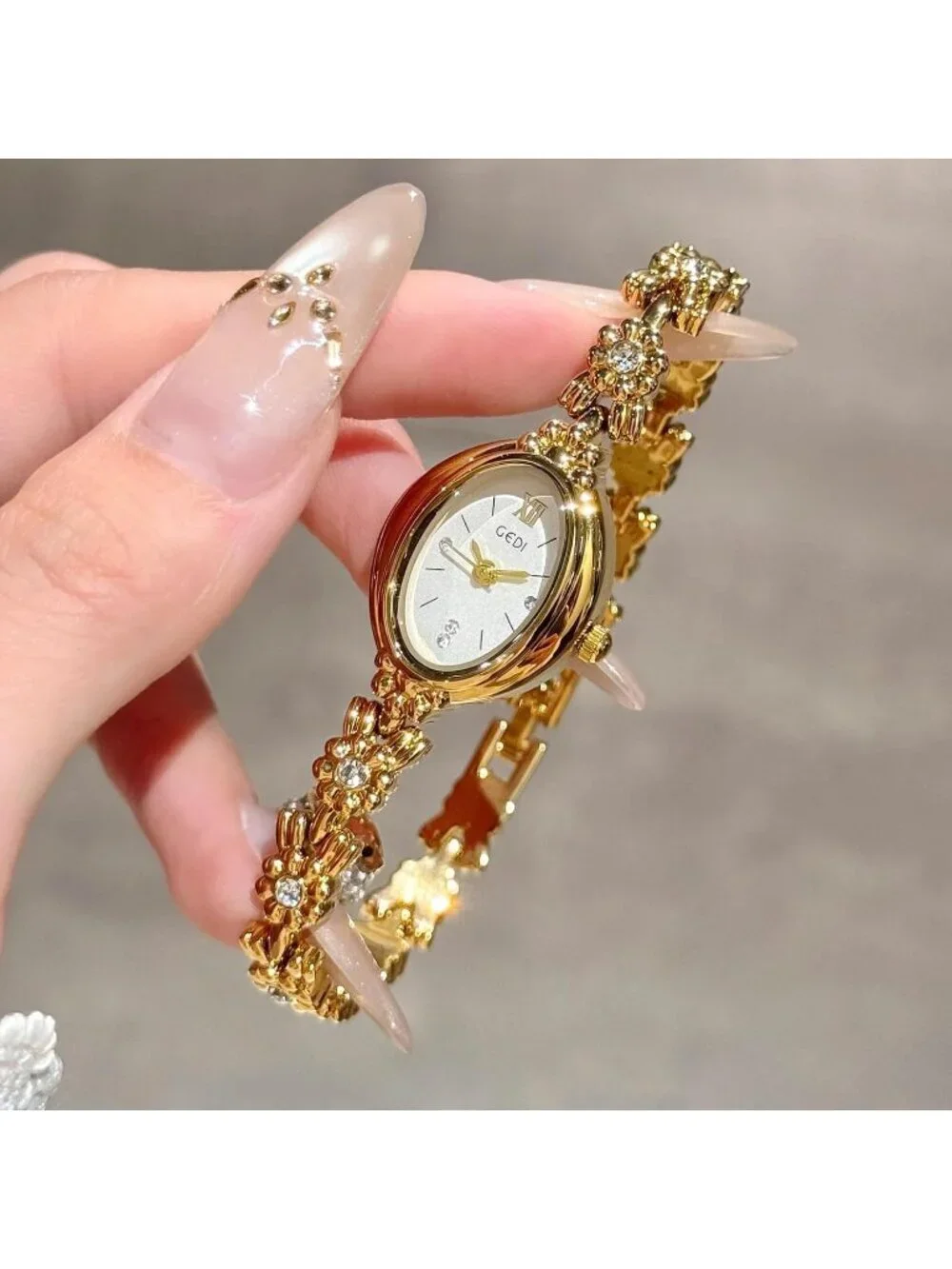 Women Gold And White Analog Quartz Alloy Steel Oval Roman Numeral Bracelet Watch